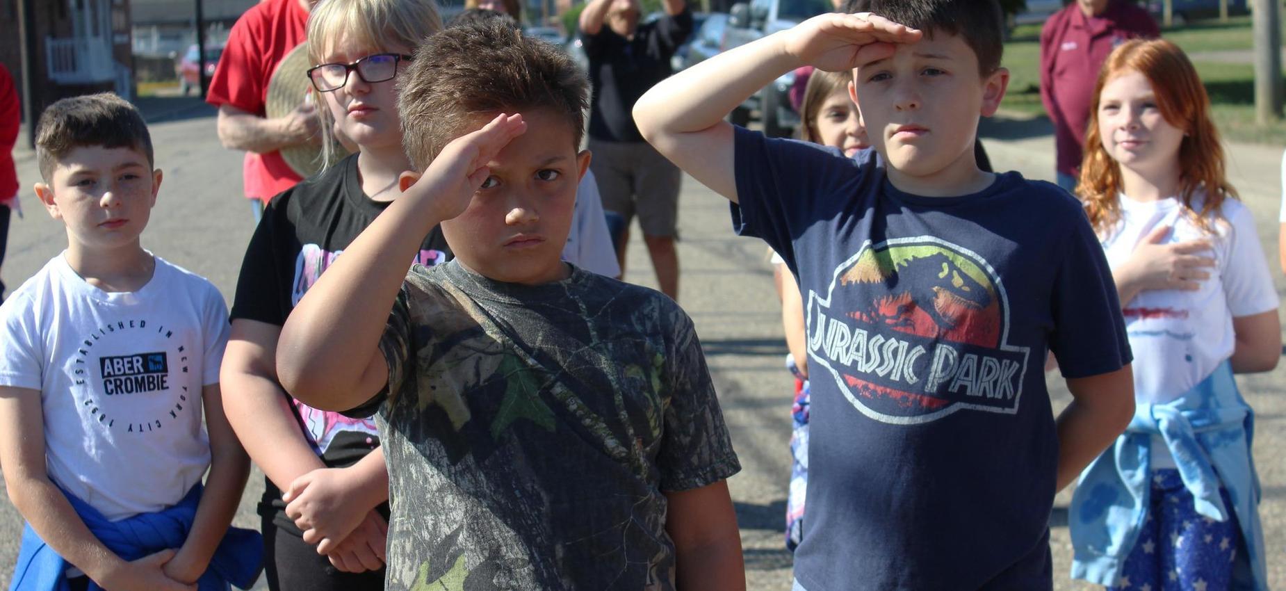 students saluting