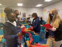 Students working on Christmas door decorations