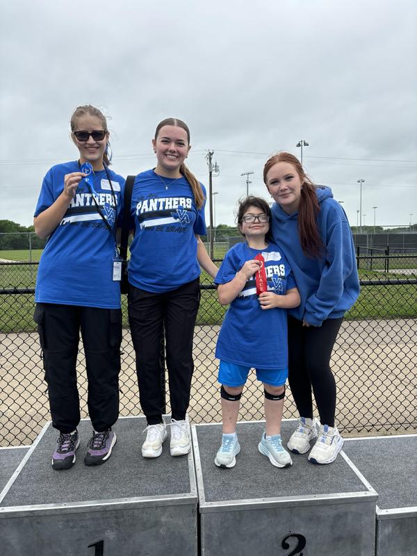 Unstoppable Athletes showing off their medals and posing with their VAHS Partners after their track meet in Anna