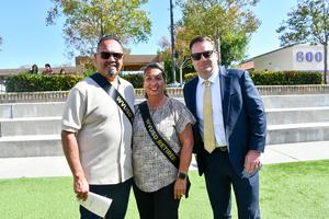 Dr. Matt Brummett poses for a photo with retirees Christina and Robert Herrera.