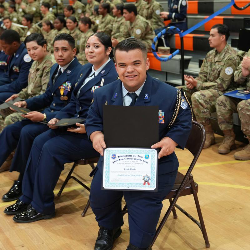 Cadet holding an award certificate
