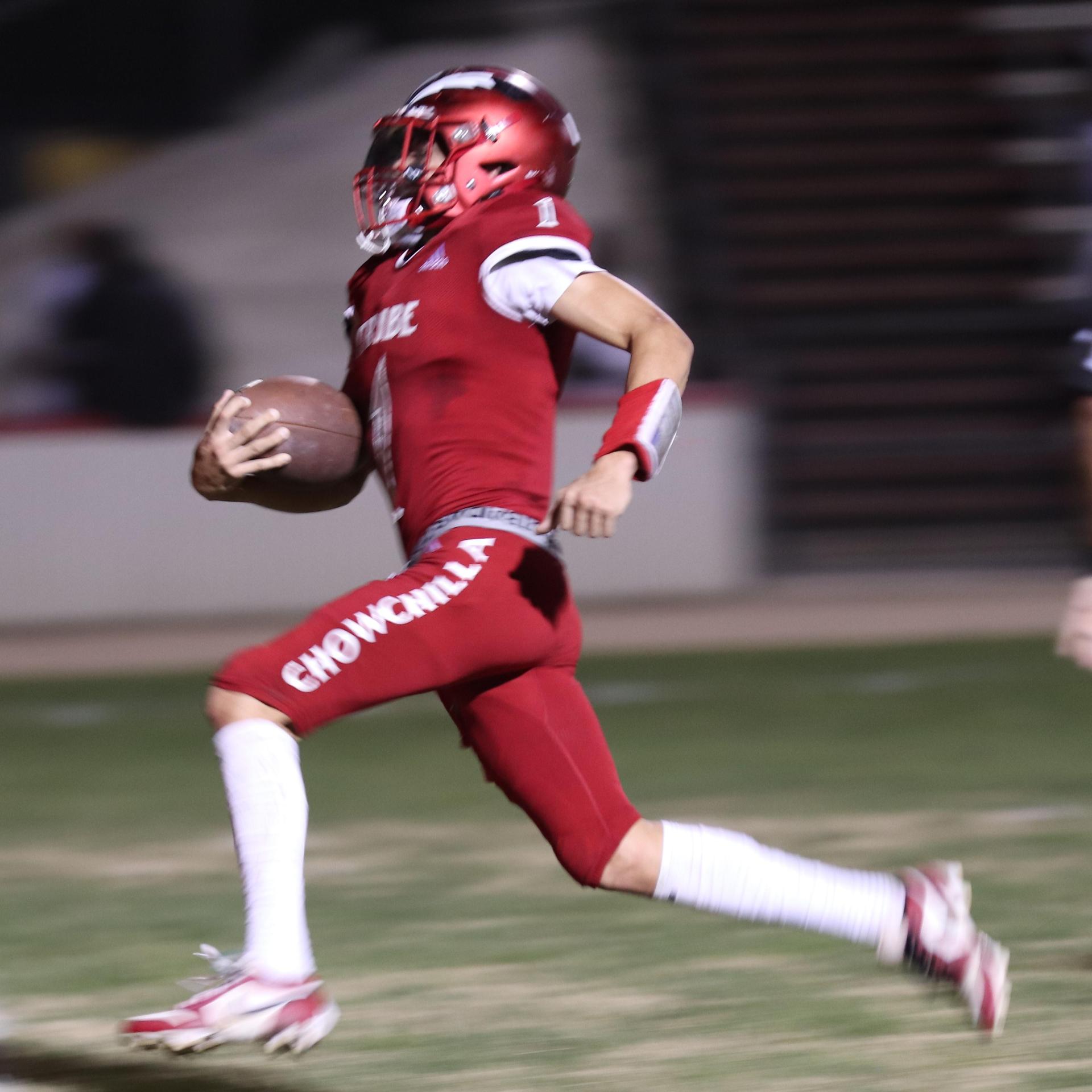 varsity boys playing football against Fowler