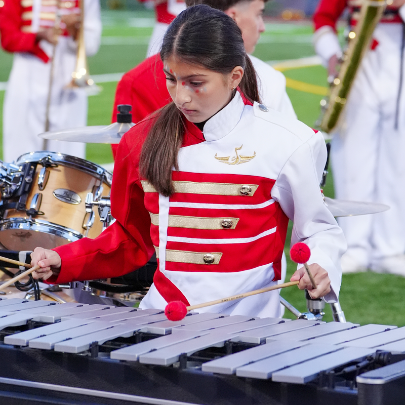 Close up of a xylophone player performing during halftime, on field