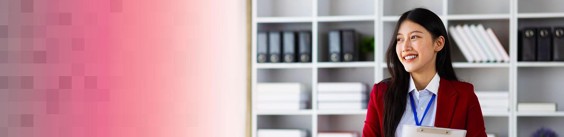 person holding a clipboard in front of a bookshelf