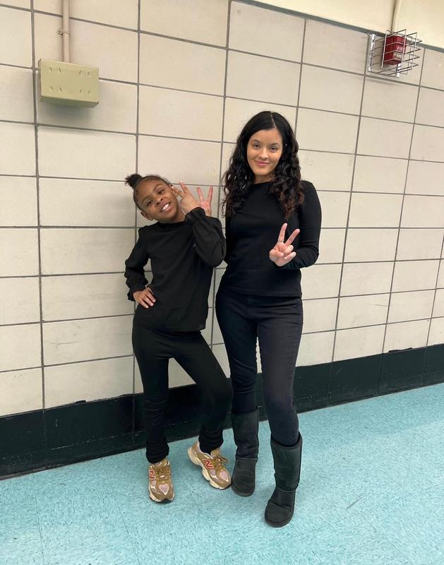 Twins wearing black - student and staff