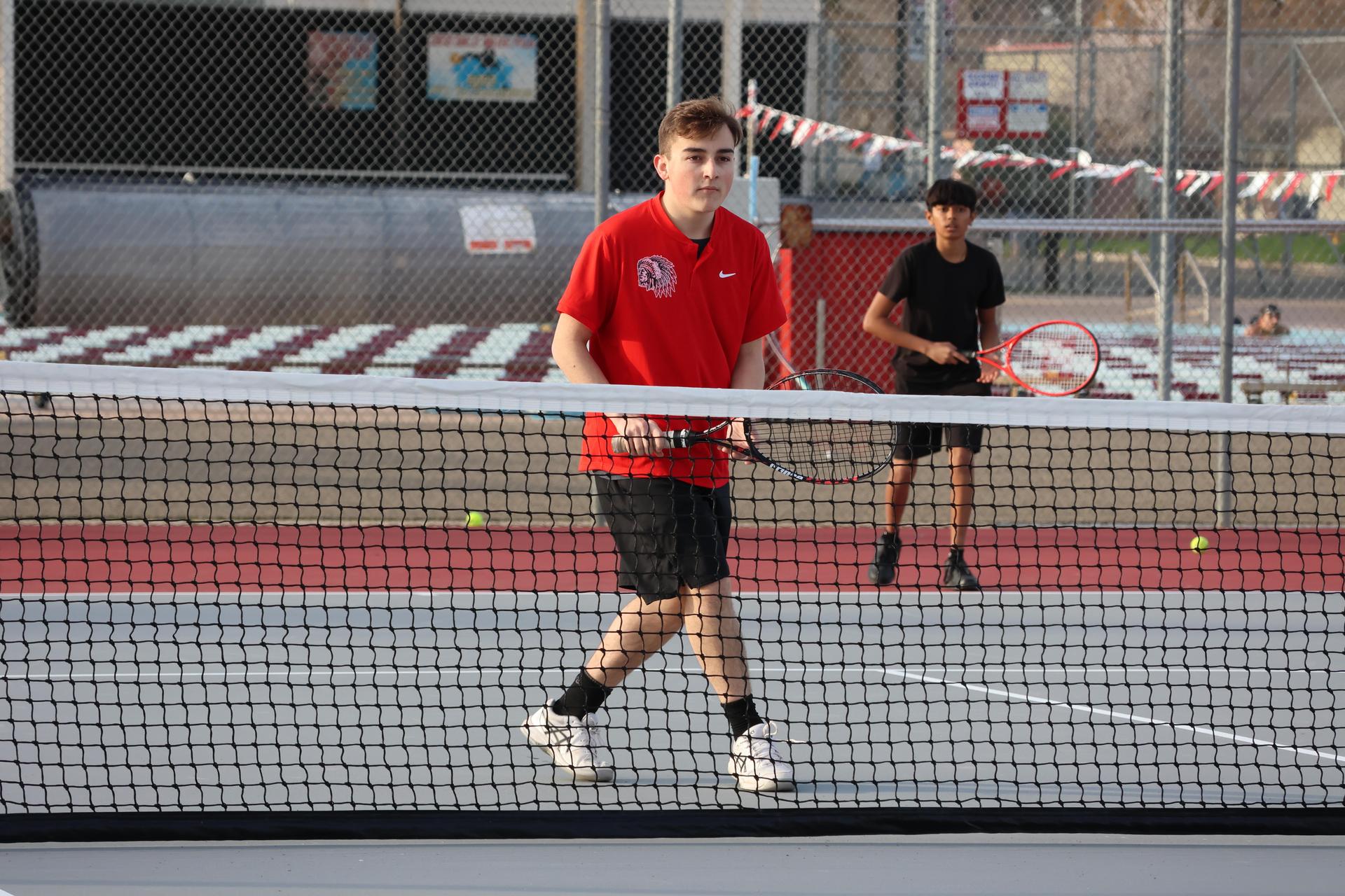 CUHS Boys playing tennis against coalinga