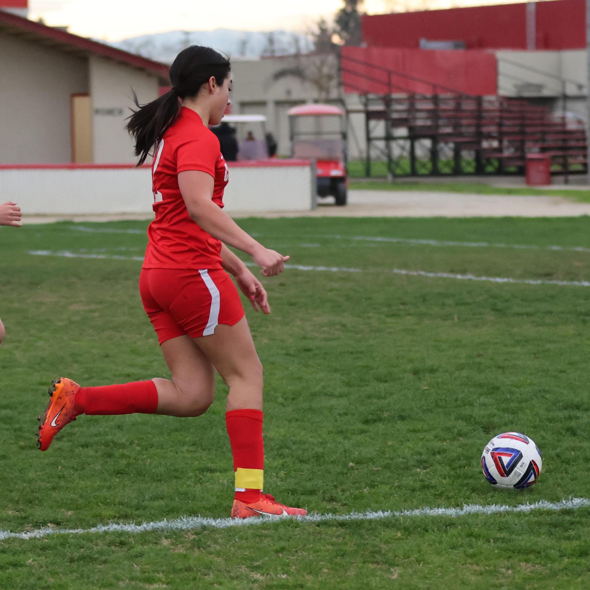 Junior varsity girls playing soccer against liberty