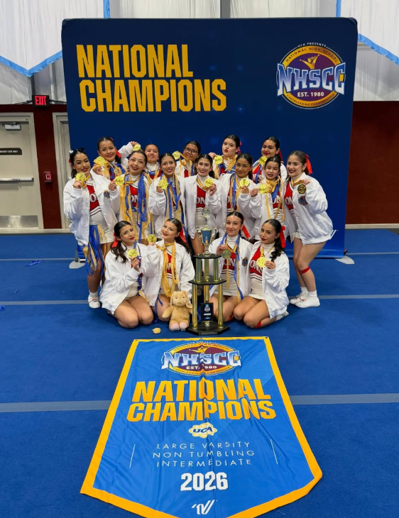 SVHS Cheer Team poses for a group photo with their trophy at Nationals