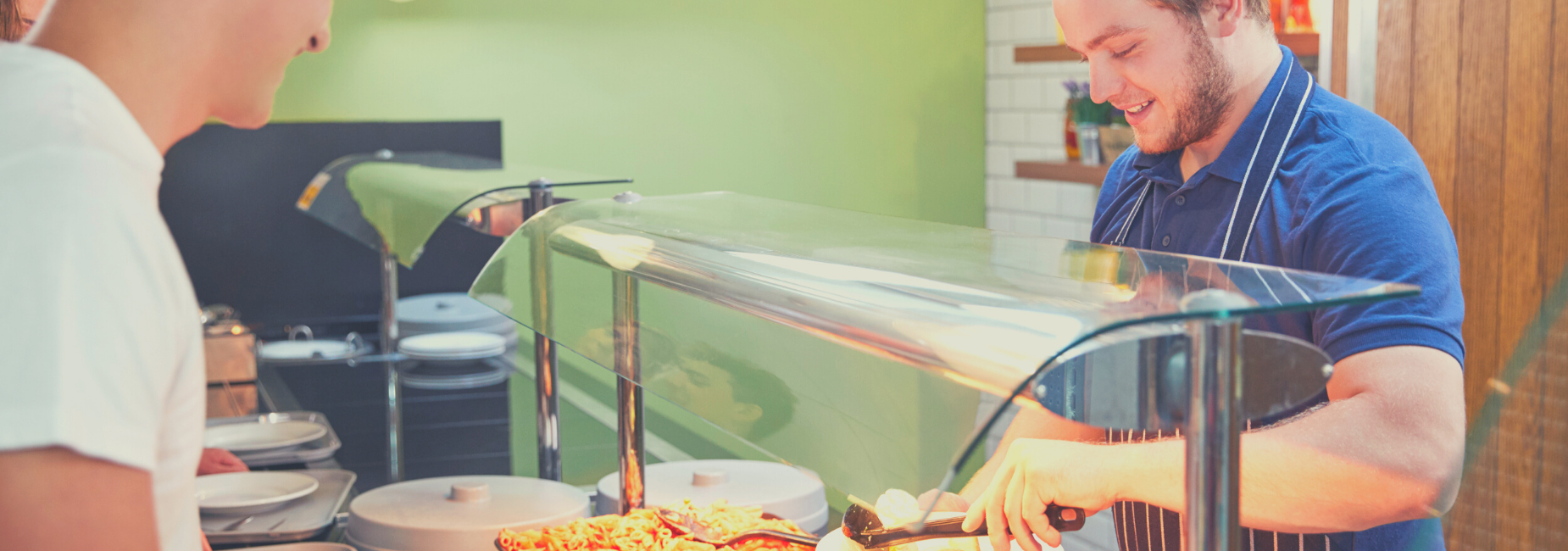 man serving student lunch