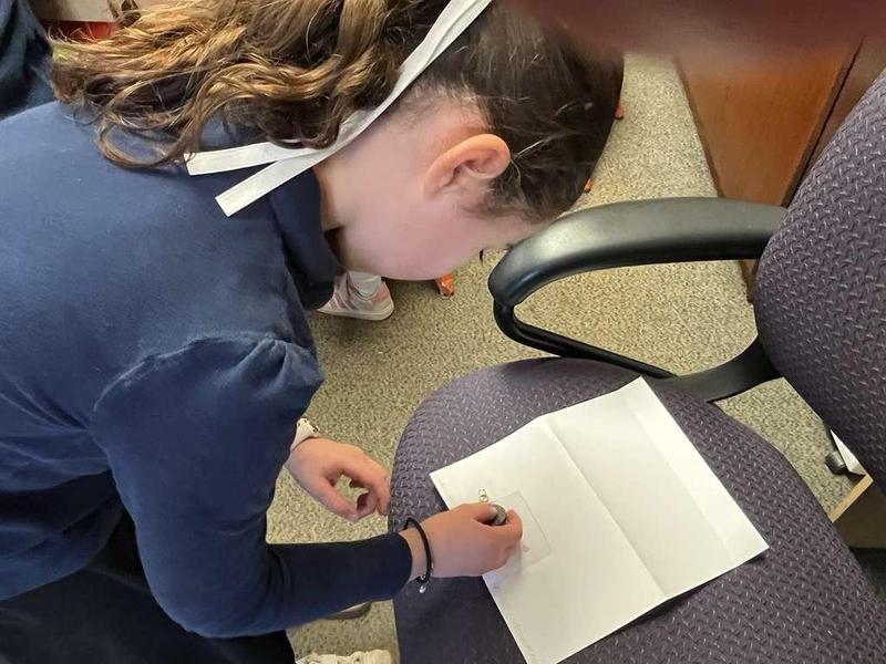 A fourth grader creates a magnetic lock.
