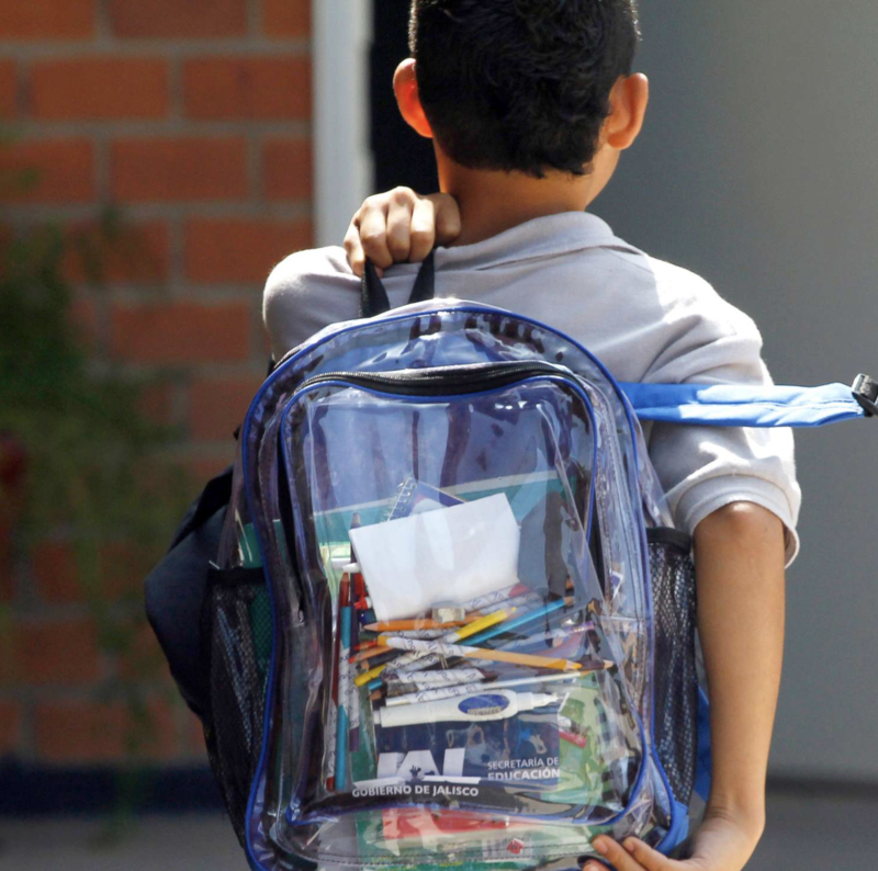 child wearing a clear backpack