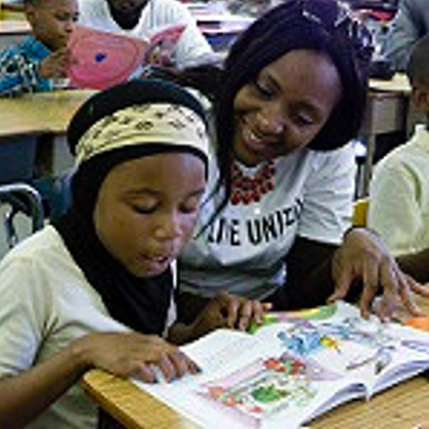 Student and teacher talking