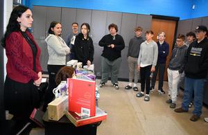 A teacher talks with students