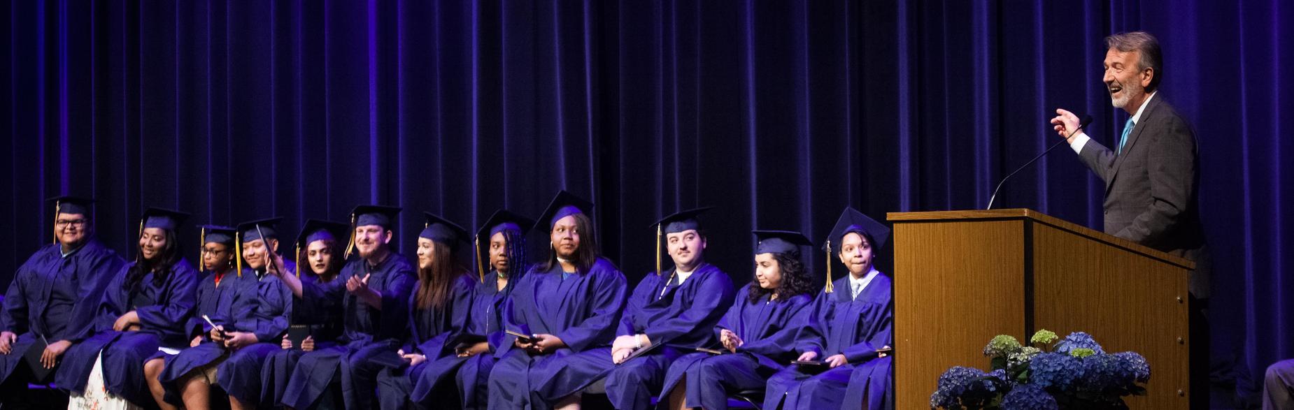 graduates on stage