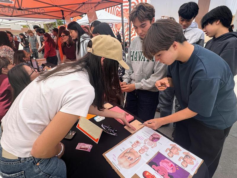 Pediatric general surgeon Dr. Roxanne Massoumi gives students a brief lesson in suturing at the 2026 SPHS Career Fair. (Photo Courtesy of South Pasadena Unified School District)