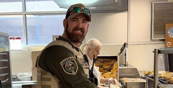 School Resource Officer serving cafeteria food