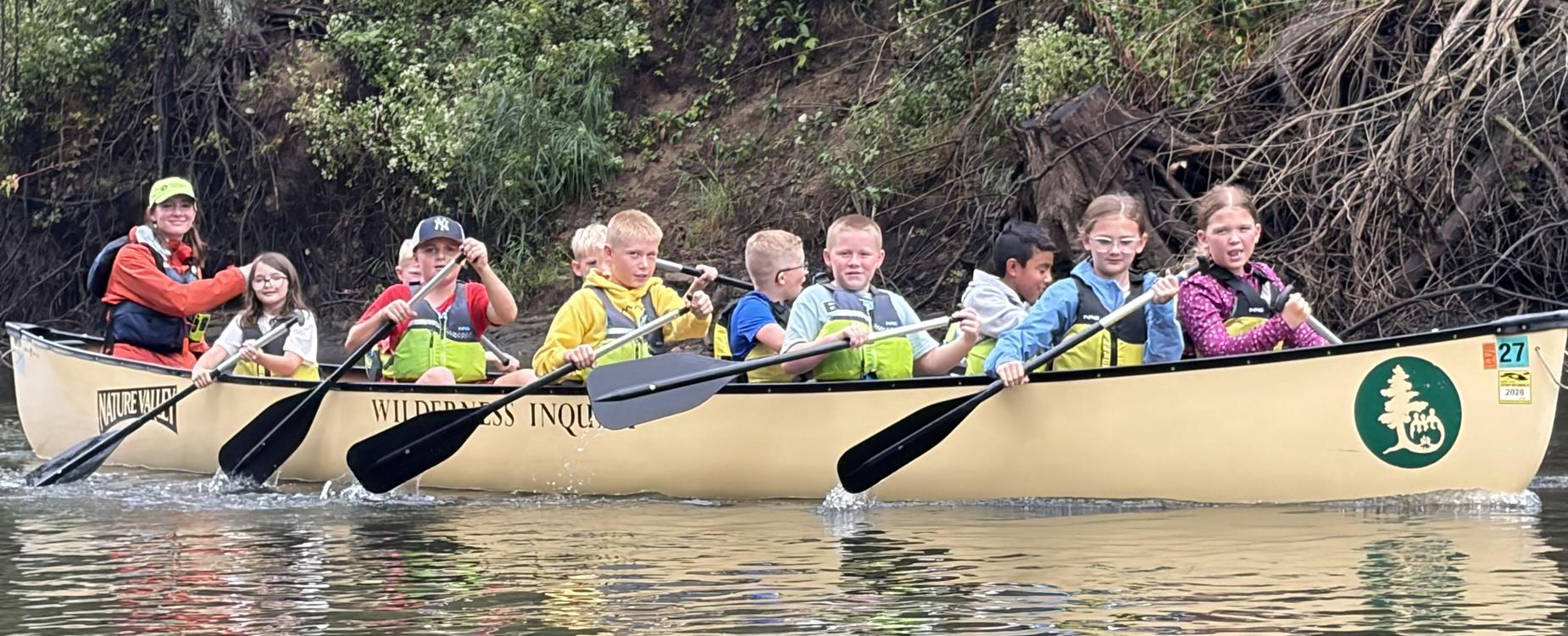 A group of students in a canoe.