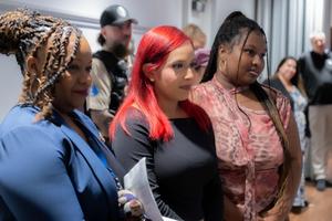 students wait their turn at board meeting
