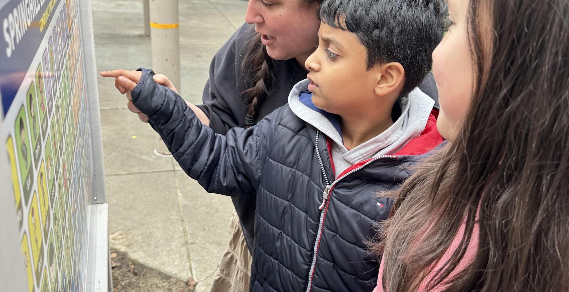 Students using communication board