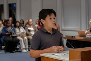 male student speaking