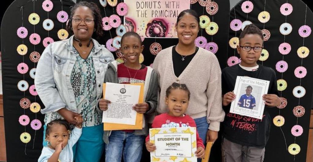 Students with family for Pup of the Month
