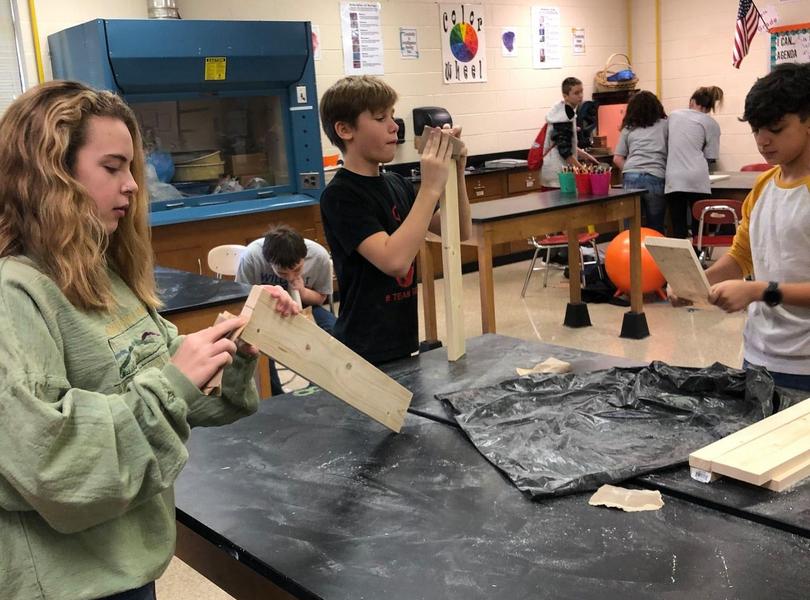 students creating in art class