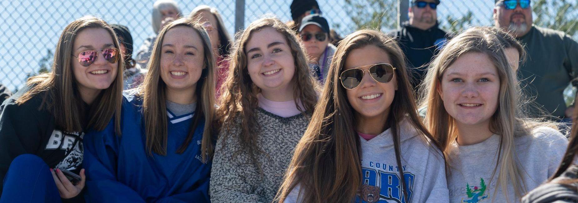girls at baseball game