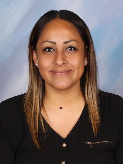 Close-up portrait of Araceli Sanchez, wearing a black top.