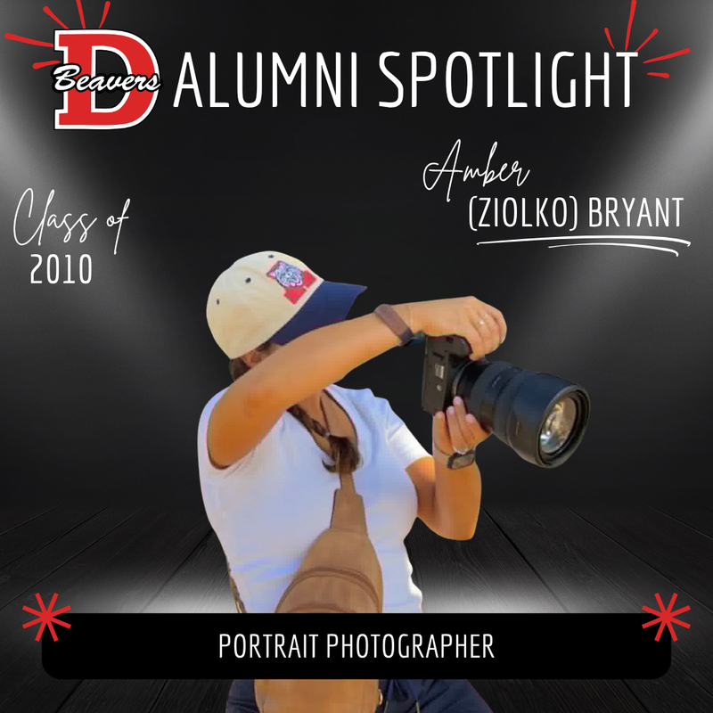 Alumni Spotlight Amber Bryant holding a camera