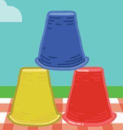 Three stacked cups in blue, yellow, and red on a picnic blanket with a blue sky.