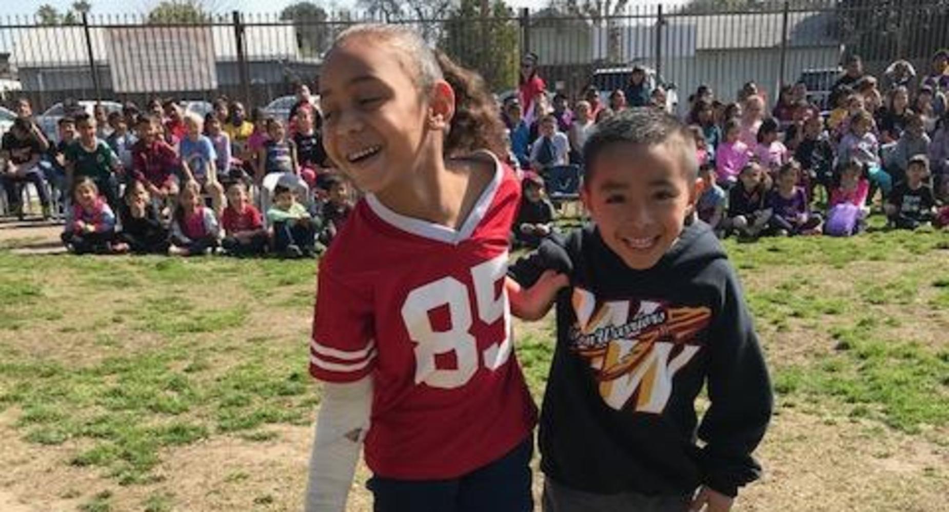 Two students playing together during POW WOW.