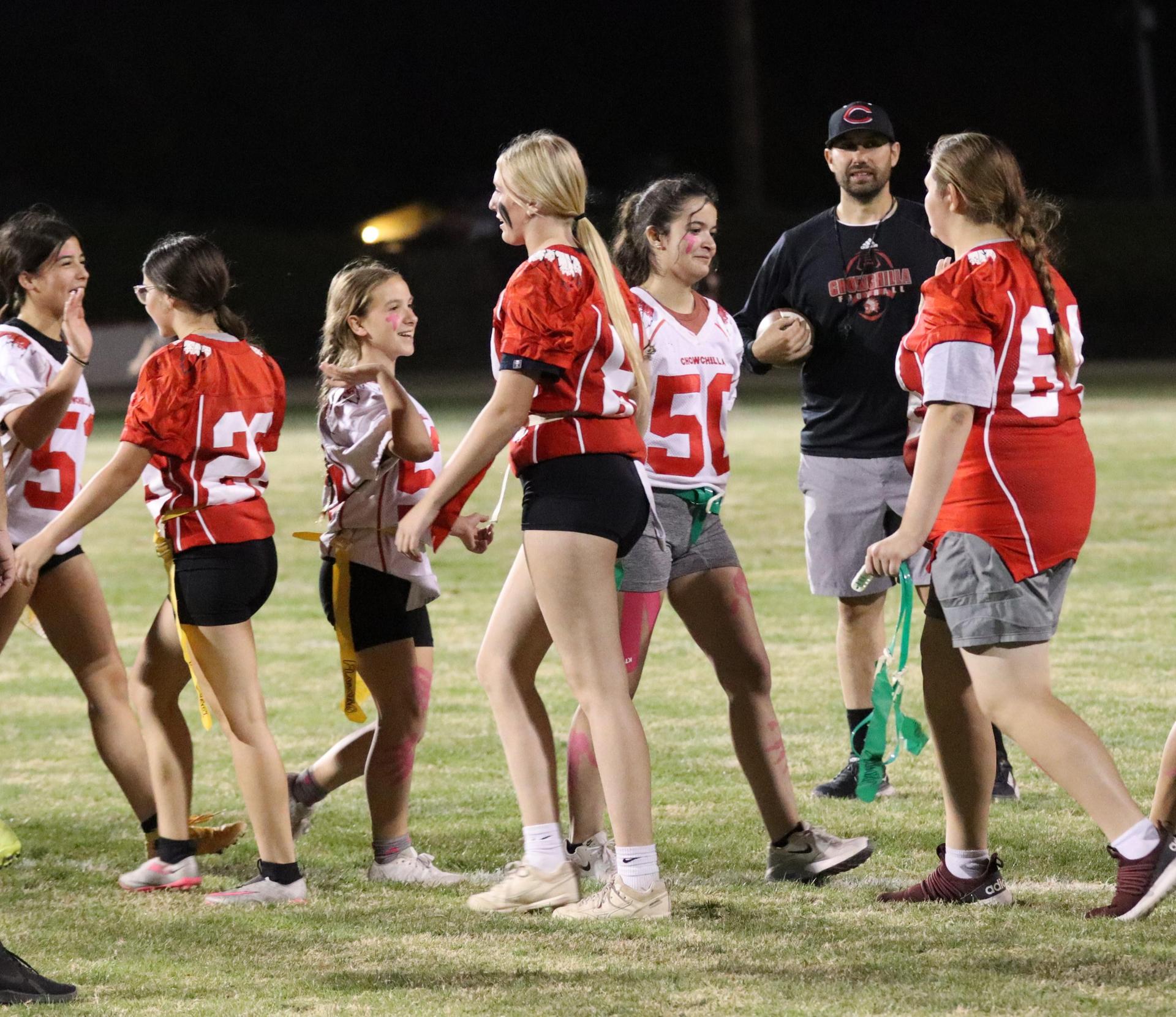 students shaking hands after the game