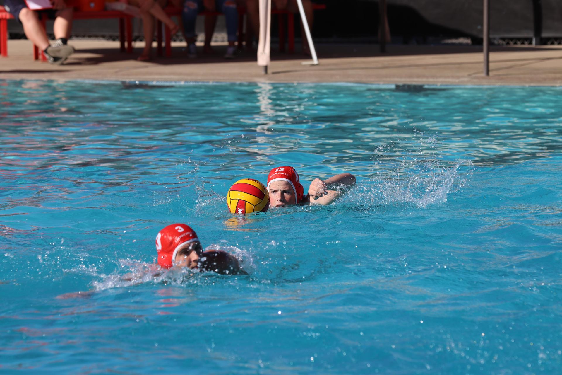 boys playing water polo against Madera