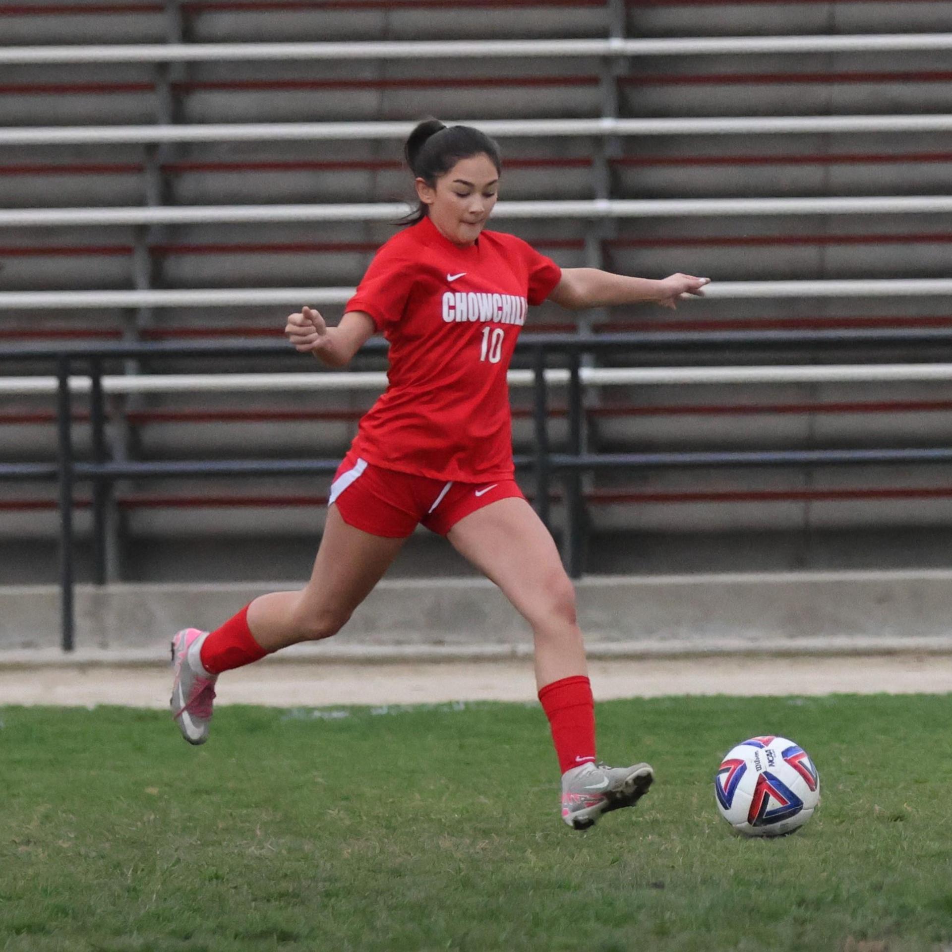 Junior varsity girls playing soccer against liberty