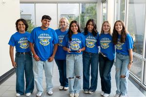 Group photo of the Frenship High School students holding the award.