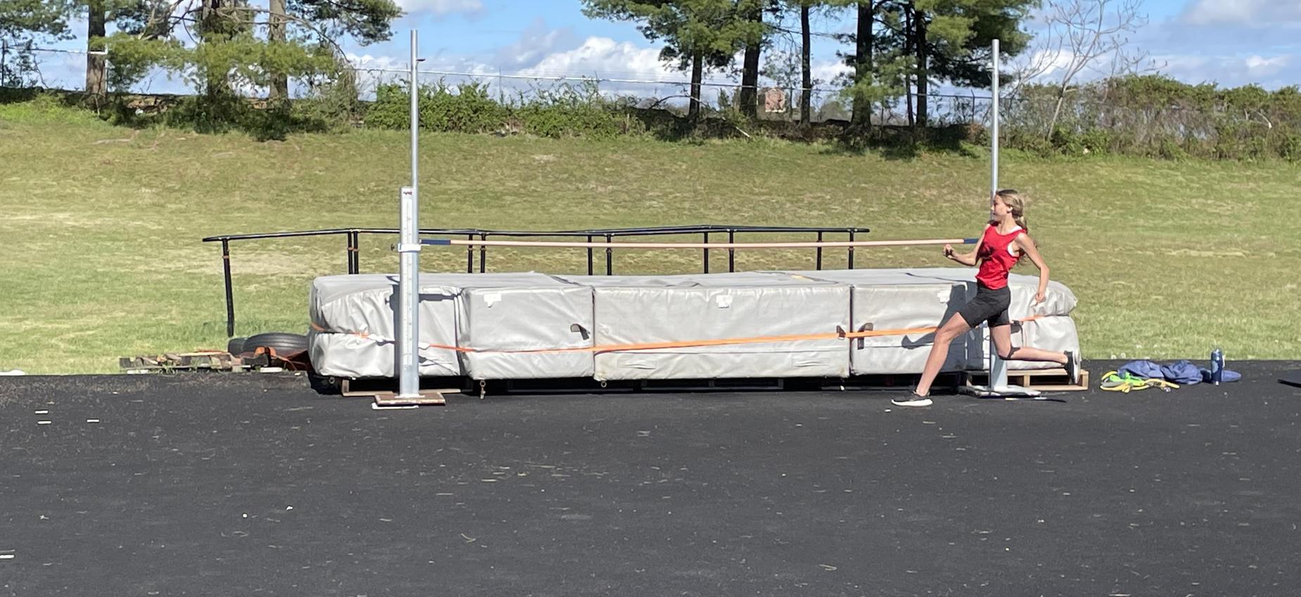 A girl participates in the high jump.