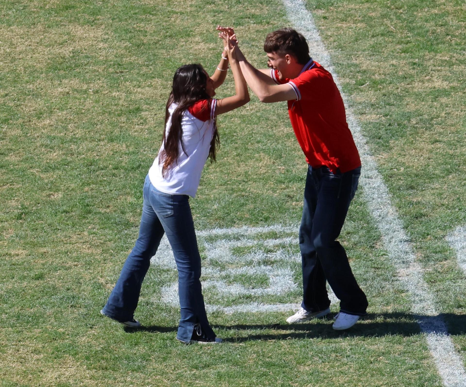 students and staff at the homecoming rally