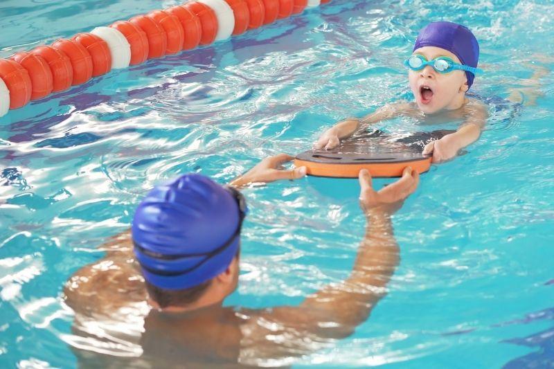 Athlete diving into deep pool water