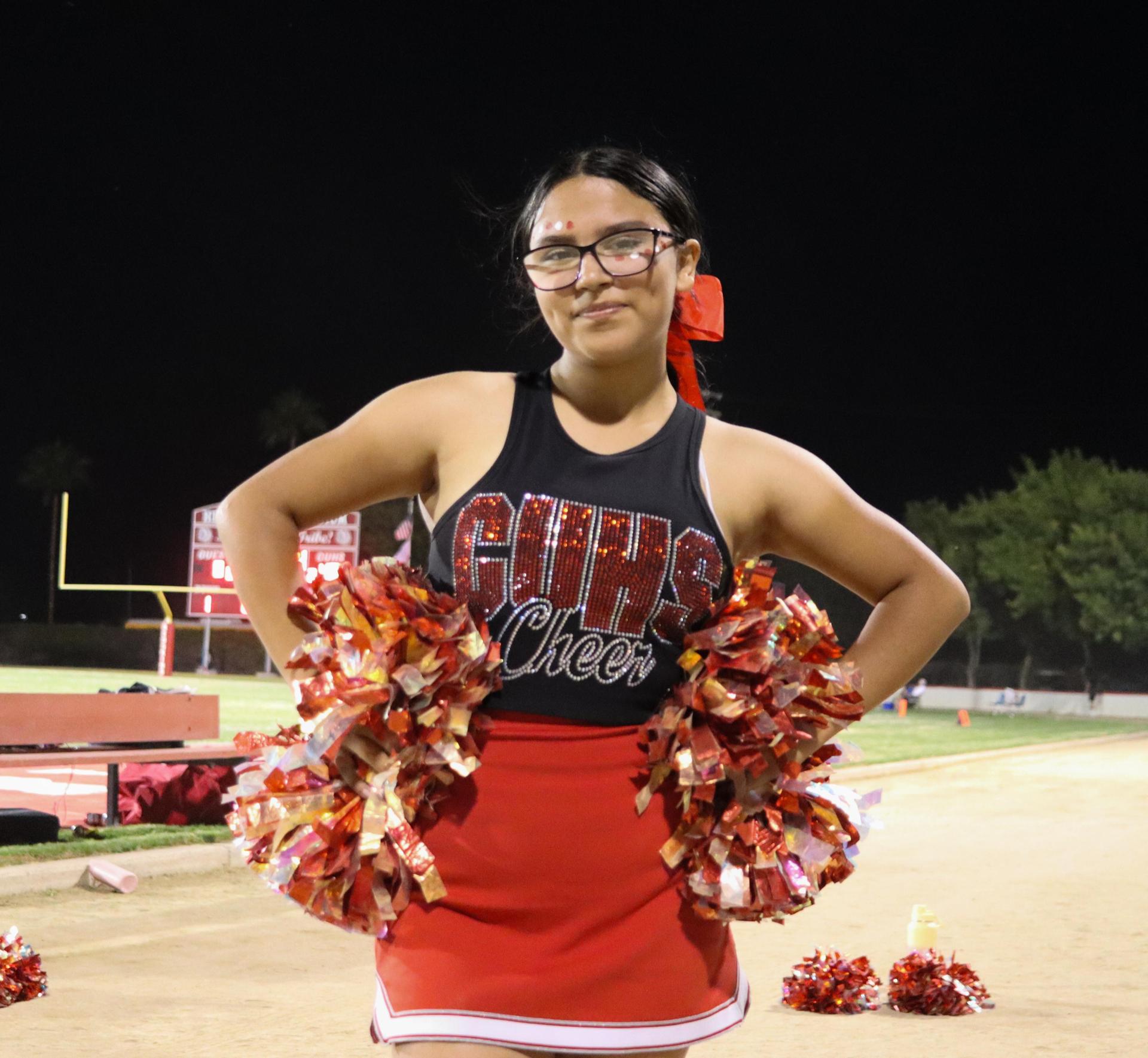 Varsity girls cheering at the Parlier football game