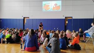 Penn Yan Elementary students gather in the gymnasium as Stanley Tucker delivers an inspiring presentation on kindness, hard work, and the importance of using words to connect with others.