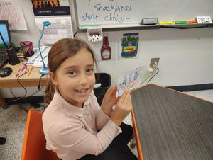 A student shows the fun shorash card she makes
