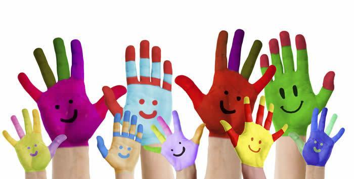 Painted children's hands with smiles