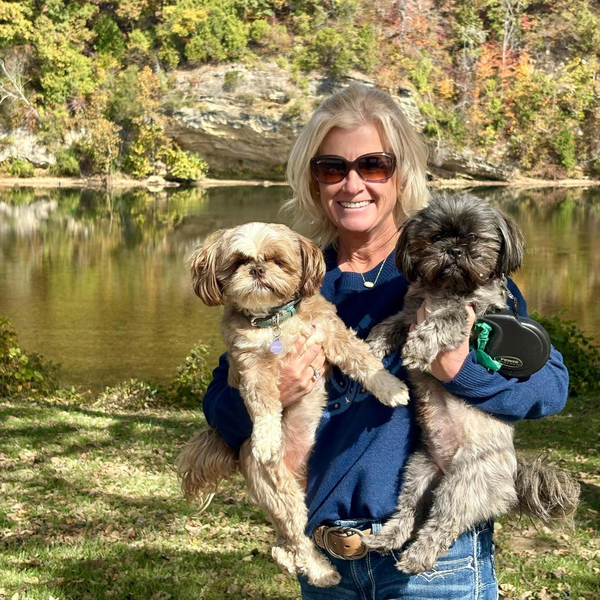 smiling woman with two dogs