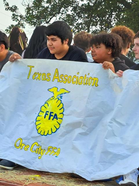 STUDENTS WITH A SIGN