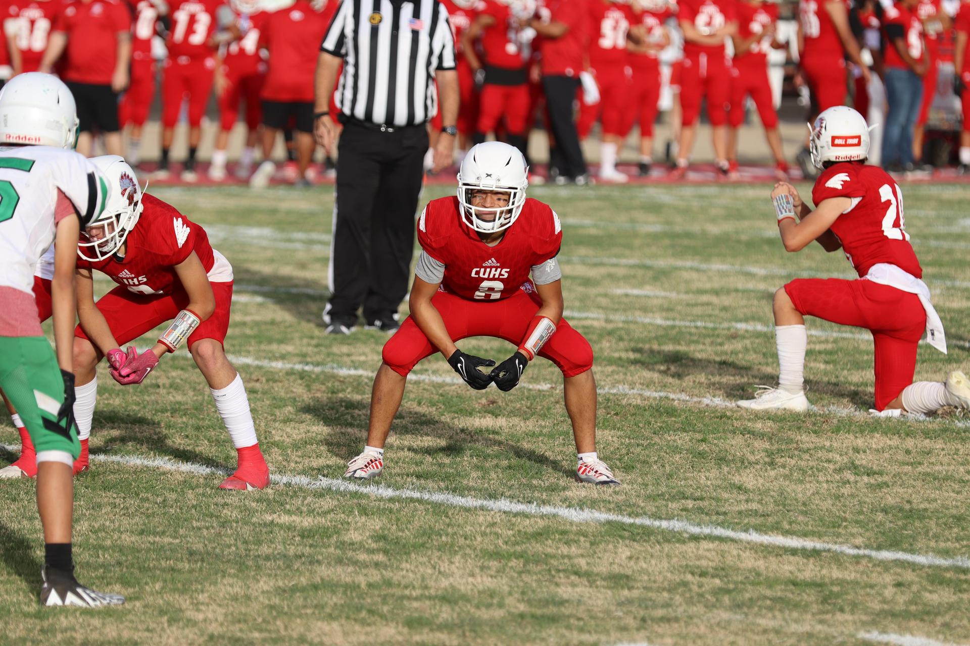  junior varsity football players in action against riverdale