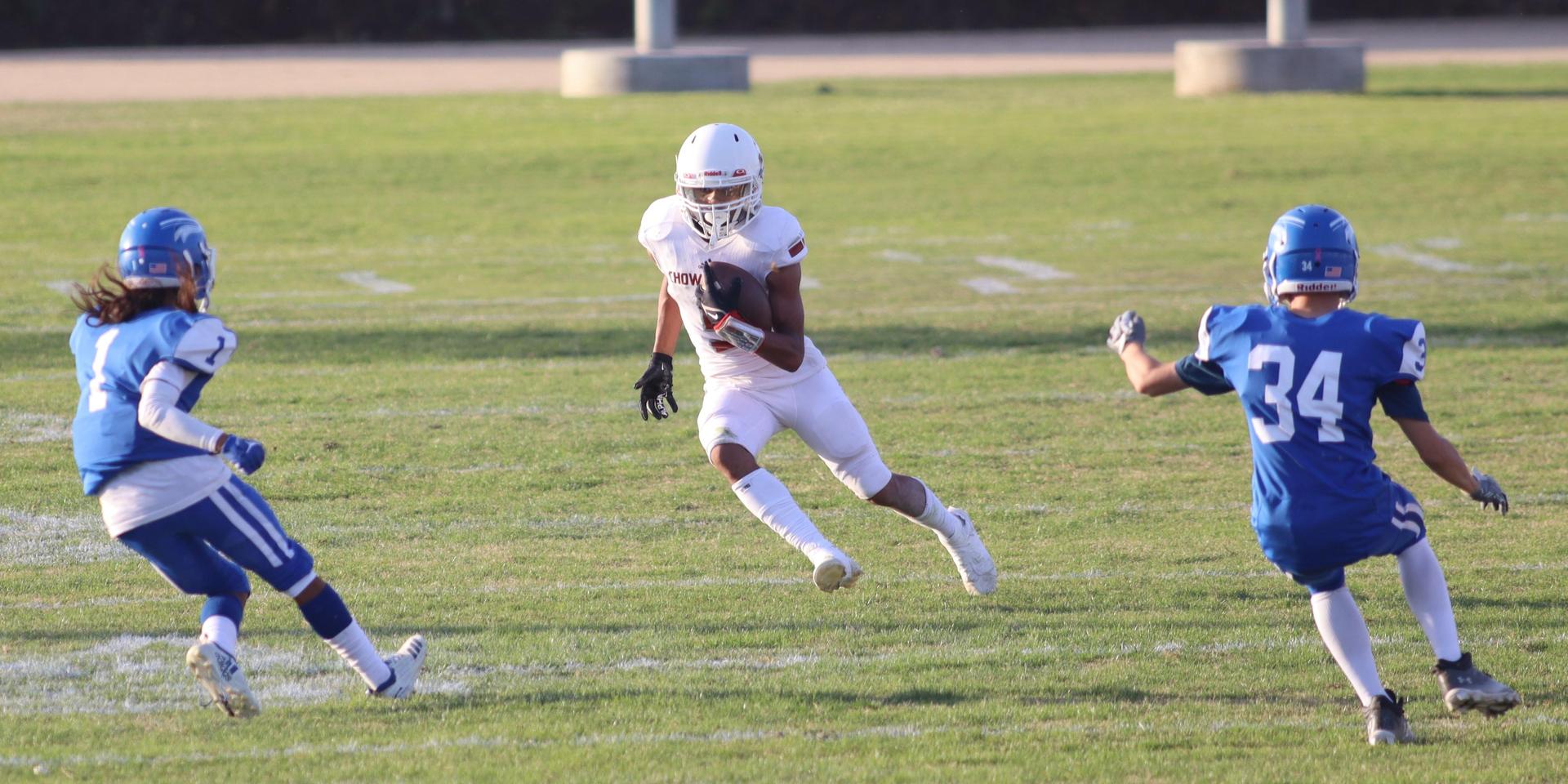Junior Varsity football players in action against Caruthers