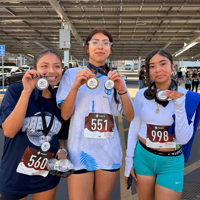 Three Girls with their Fun Run Medals