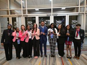 Smiling group of students, some with awards