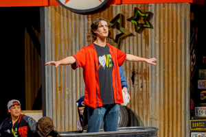 Main lead in Godspell, the MHS winter musical spreading his arms as he sings opening number.
