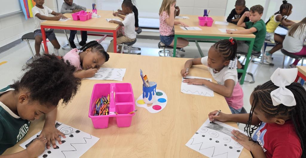 Students drawing during art class.
